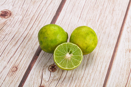 Fresh sour green lime fruit with halfの写真素材