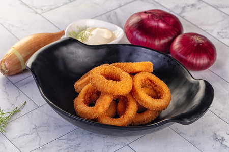 Golden fried breaded onion rings snackの写真素材
