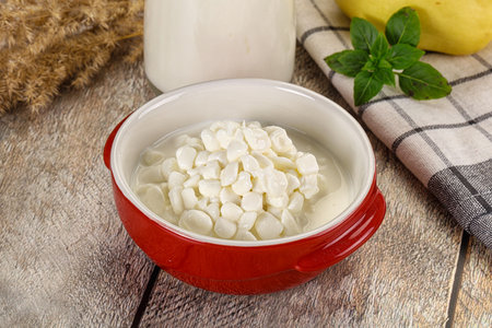 Grain cottage cheese with sour in the bowlの写真素材