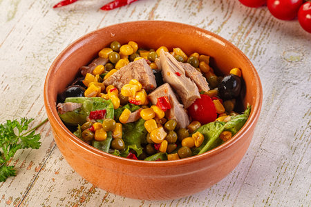 Dietary salad with canned tuna, peas, tomato and cornの写真素材