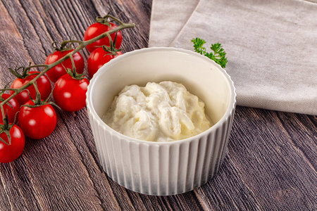 Italian delicous stracciatella young soft cheese in the bowlの写真素材