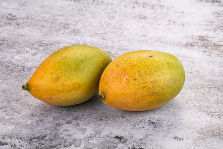 Sweet juicy ripe yellow mango fruitの写真素材