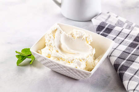 Cream cheese in the bowl served mintの写真素材