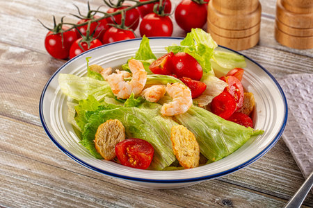 Caesar salad with prawn, tomato and romanoの写真素材