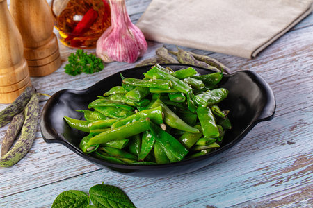 Steamed green bean strings heap with olive oilの写真素材