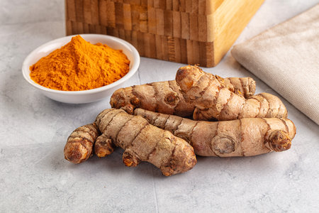 Fresh aroma turmeric roots heap served powderの写真素材