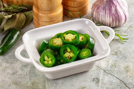 Hot spicy sliced jalapeno pepper heap