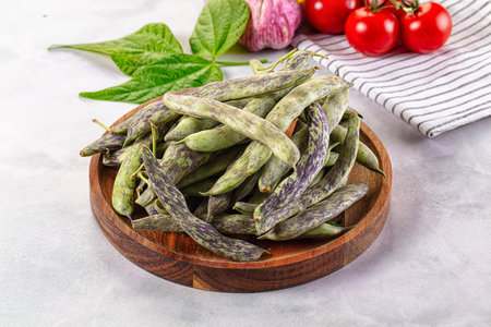 Raw green bean strips heap in the bowl