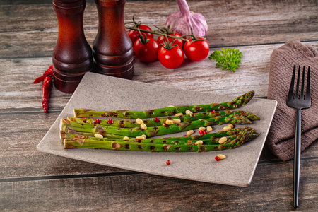 Grilled asparagus sprouts with cedar nutsの写真素材