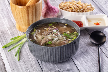 Vietnamese Pho Bo soup with beef and noodles