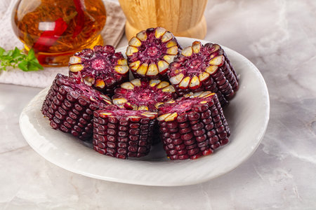 Ripe boiled black corn maize garnishの写真素材