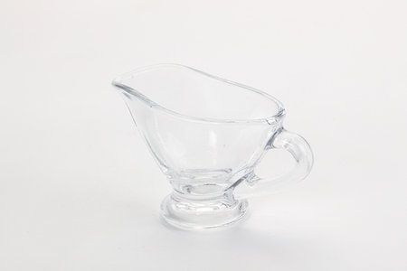 Empty gravy pot for sauce isolated dishwareの写真素材