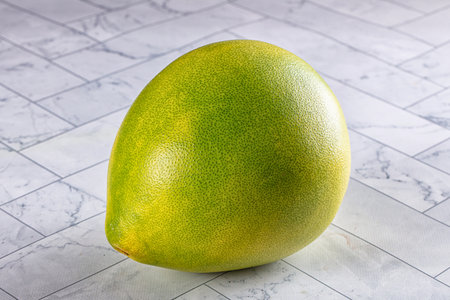 Sweet juicy green tropical Oroblanco citrusの写真素材