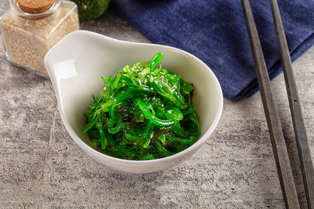 Green raw chuka seaweed salad with sesame sauceの写真素材