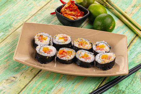 Korean homemade roll Kimbap with nori seaweed, sausages and vegetables