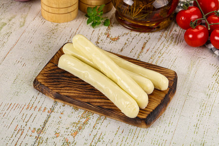 White mozzarella sticks over board snack