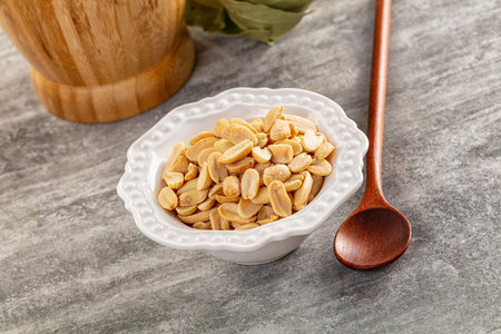 Tasty salted roasted peanut heap in the bowl