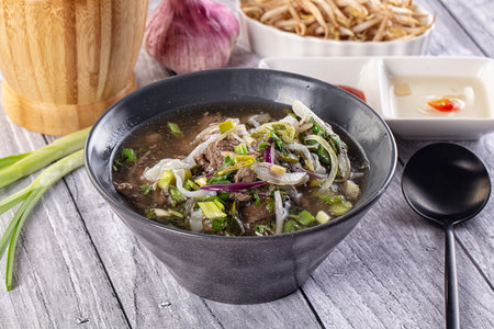 Vietnamese Pho Bo soup with beef and noodles