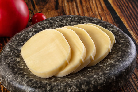 Sliced mozzarella cheese for snack or cookingの写真素材
