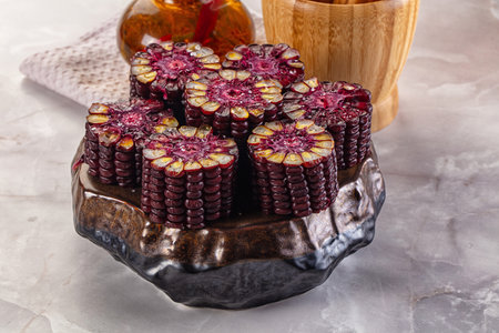 Ripe boiled black corn maize garnishの写真素材