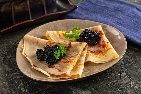 luxury pancake with strugeon black caviarの写真素材