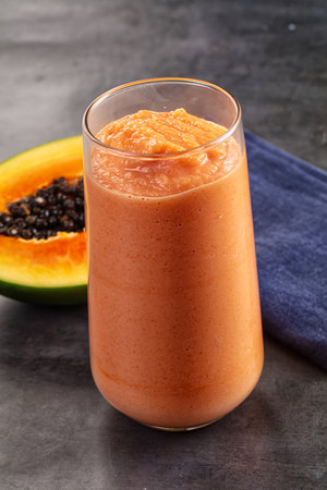 Sweet juicy papaya smoothie detox drinkの写真素材