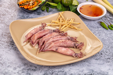 Boiled wild mini calamari snack with ginger