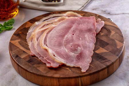 Sliced pork ham over board for snack