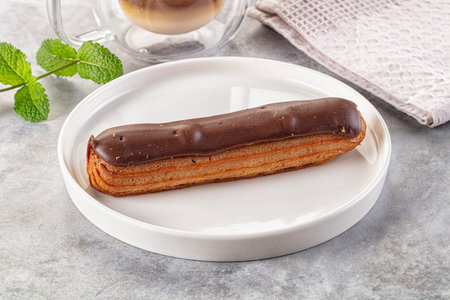 Gourmet chocolate eclair with brown icing