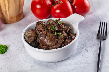 Roasted chicken liver with green onion and spicesの写真素材