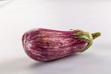 Stripped ripe purple natural eggplantの写真素材