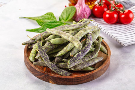 Raw green bean strips heap in the bowl