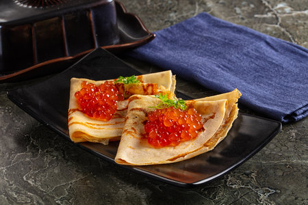 Gourmet traditional pancakes with red caviarの写真素材