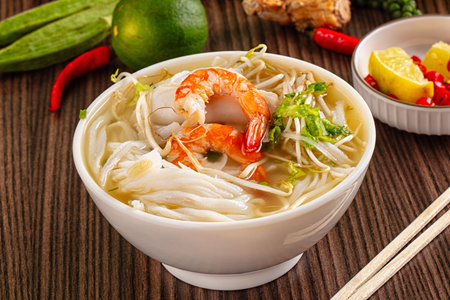 Vietnamese soup Pho with seafood - prawn and calamari