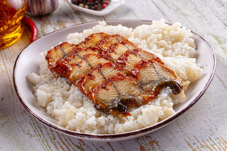Japanese style cuisine - grilled eel with steamed rice and sauce