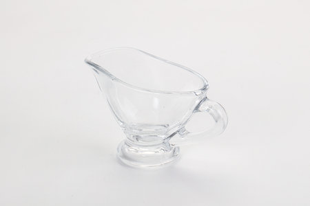 Empty gravy boat for sauce isolated dishwareの写真素材