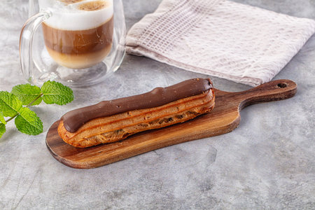 Gourmet chocolate eclair with brown icing