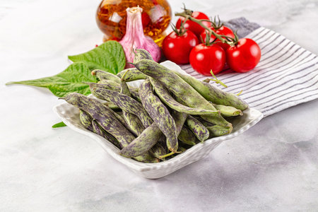Raw green bean strips heap in the bowl