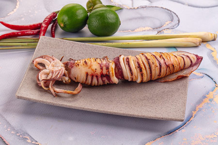 Tasty grilled wild squid with lime - Asian streetfood