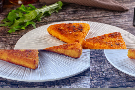 Fried golden fish cutlets triangles in the plate