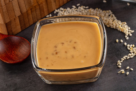 Asian sesame sauce dip with seeds for salad