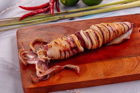 Tasty grilled wild squid with lime - Asian streetfood