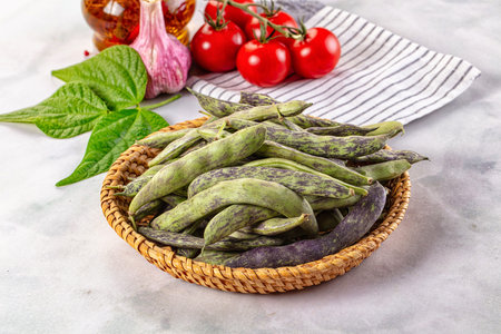 Raw green bean strips heap in the bowl