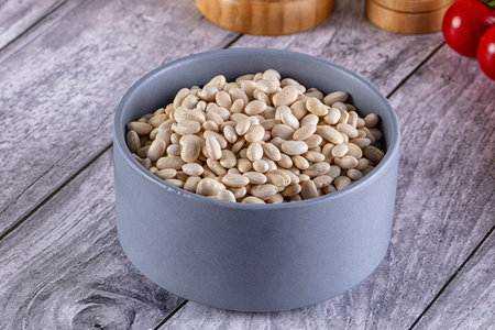 Raw white beans for cooking in the bowl