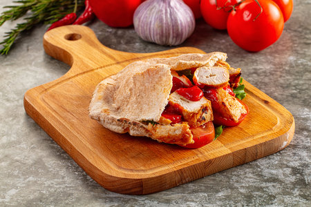 Pita with chicken and vegetables - tomato and saladの写真素材