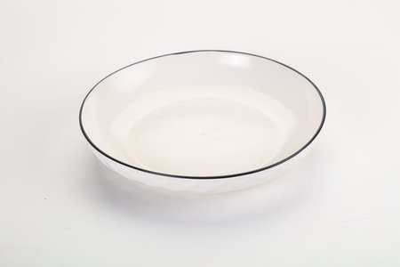 White ceramic empty clean plate dishware isolatedの写真素材