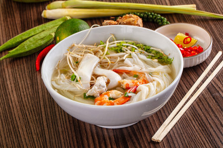 Vietnamese soup Pho with seafood - prawn and calamari