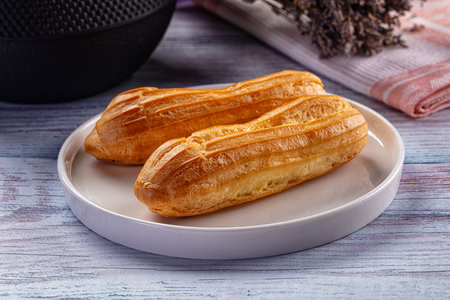 Sweet baked eclair dessert with custard cream