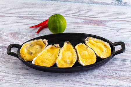 Plate of Baked oyster with parmesan cheeseの写真素材