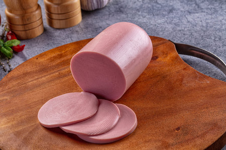 Boiled pork pink sausages with slices for breakfast